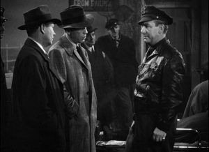 Humphrey Bogart, Regis Toomey, and Emmett Vogan in The Big Sleep (1946)